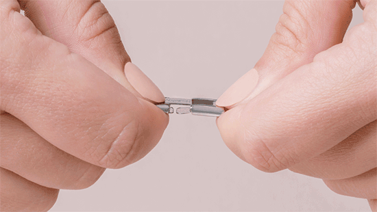 Grasp the two Charms you want to separate and unhook them